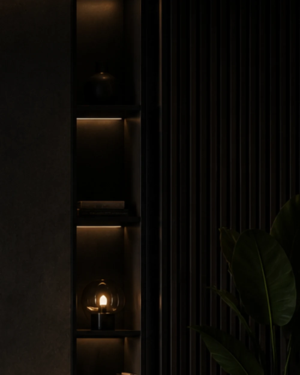 A dark shelving niche lit from within by concealed warm LED strips.